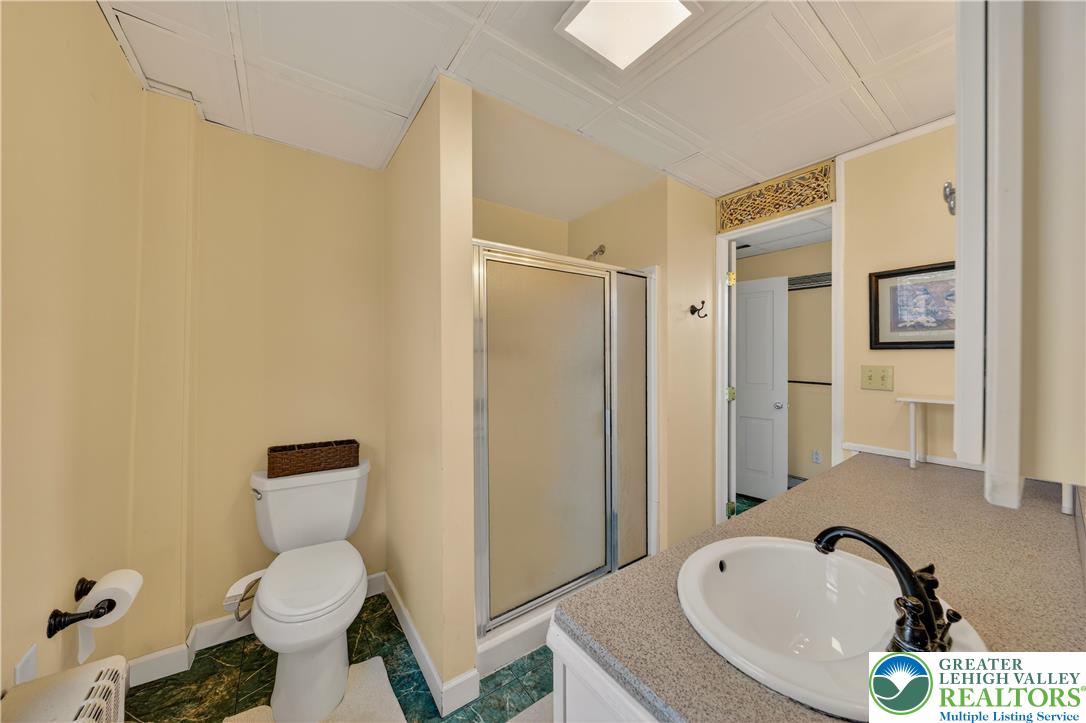 945 Main Street Bethlehem, PA 18018 - Photo 41 of 75 a bathroom with a sink and a tub