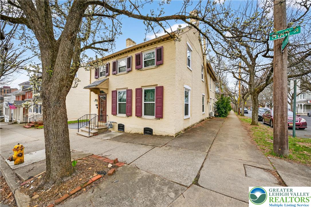 945 Main Street Bethlehem, PA 18018 - Photo 5 of 75 a view of a white house with a large tree
