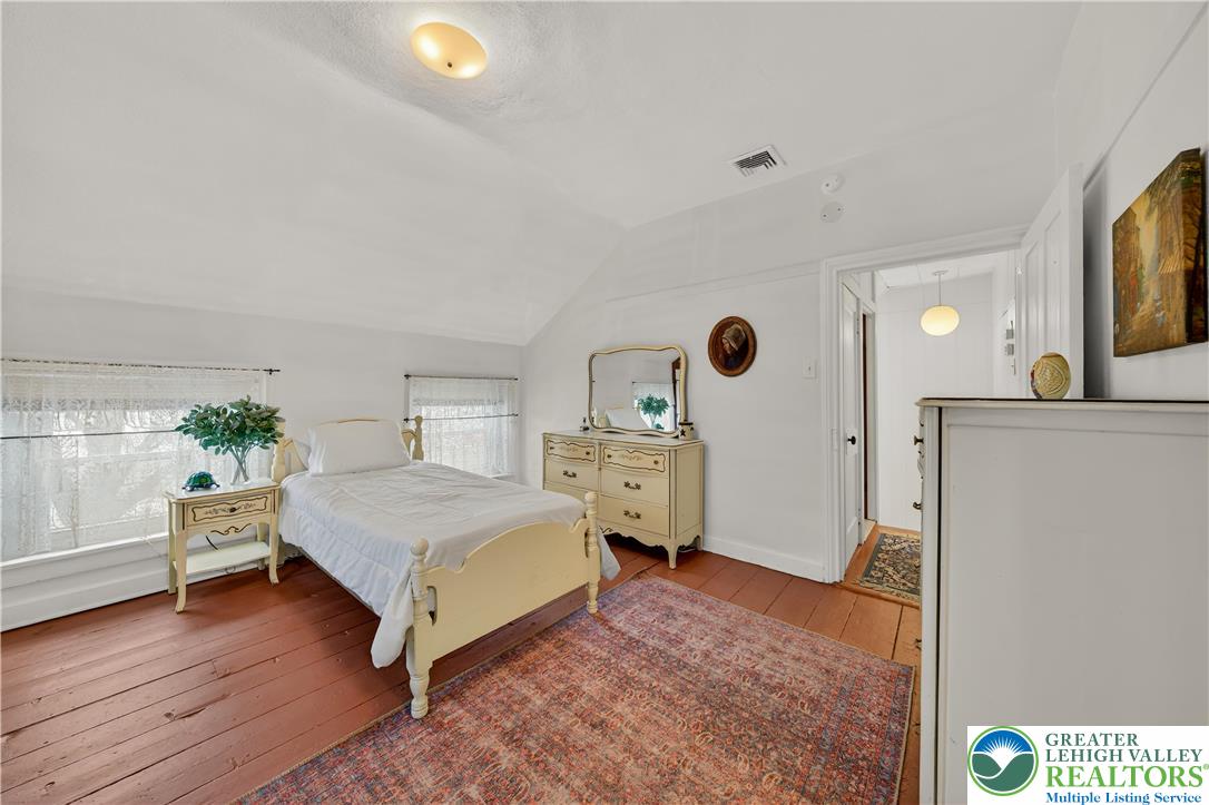 945 Main Street Bethlehem, PA 18018 - Photo 51 of 75 a spacious bedroom with a bed and a window