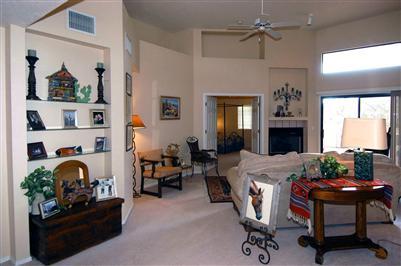 4992 North Valle Road Tucson, AZ 85750 - Photo 2 of 10 a view of a livingroom with furniture and a fireplace