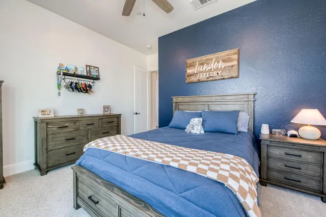 a bedroom with furniture and a window