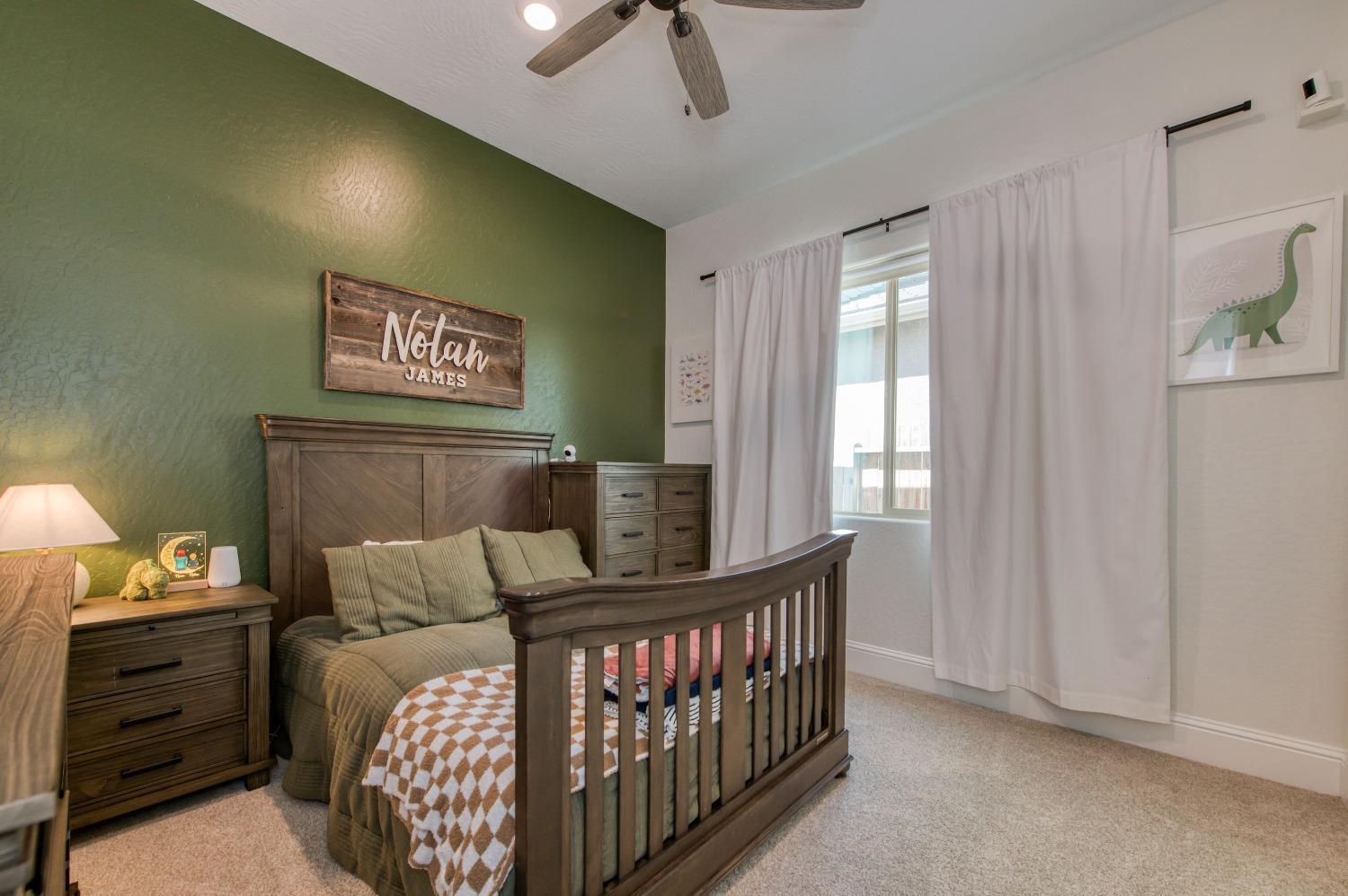 678 Ponderosa Way Madera, CA 93636 - Photo 18 of 38 a bedroom with furniture and a window