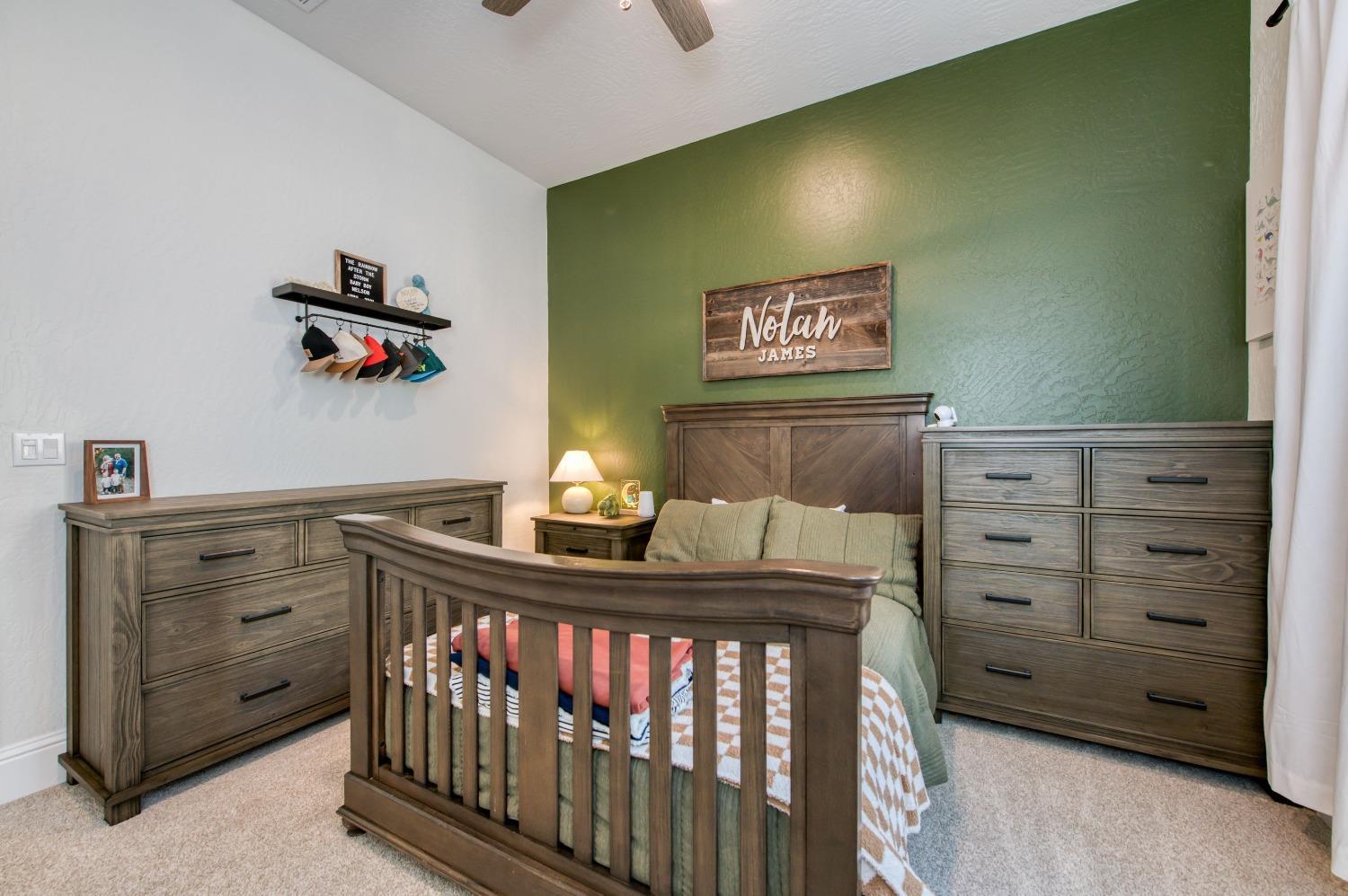 678 Ponderosa Way Madera, CA 93636 - Photo 19 of 38 a bedroom with a bed and a dresser