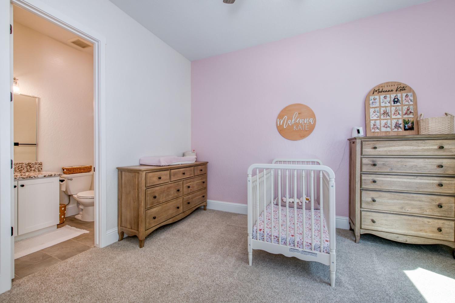 678 Ponderosa Way Madera, CA 93636 - Photo 23 of 38 a view of a bedroom with baby bed