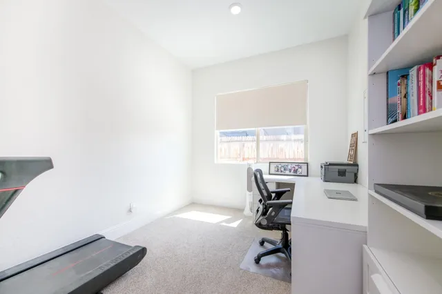 a bedroom with a bed and a couch