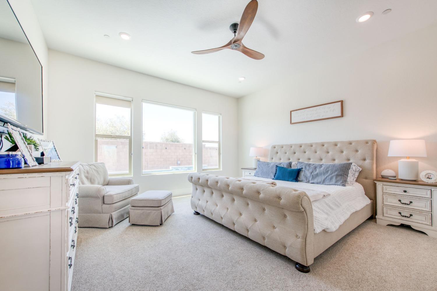 678 Ponderosa Way Madera, CA 93636 - Photo 26 of 38 a bedroom with a bed and a couch