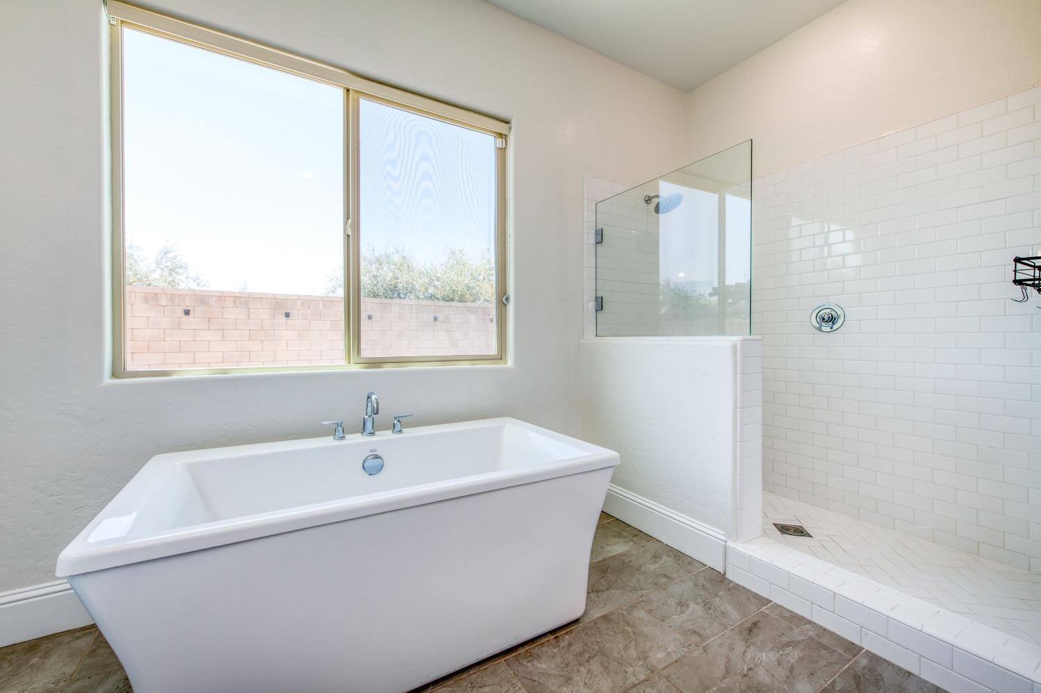 678 Ponderosa Way Madera, CA 93636 - Photo 29 of 38 a white bath tub sitting next to a window