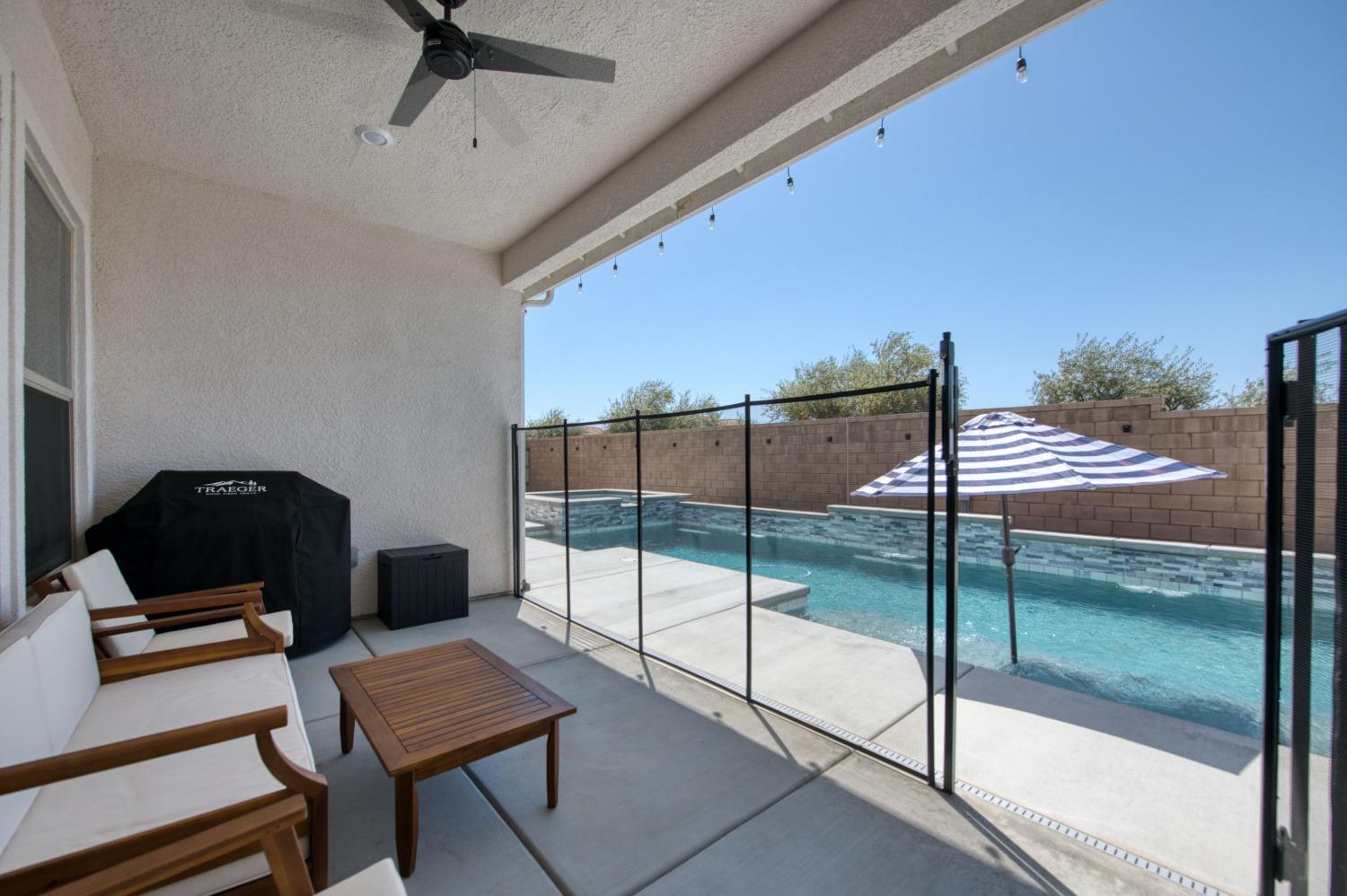678 Ponderosa Way Madera, CA 93636 - Photo 30 of 38 a living room with a couch