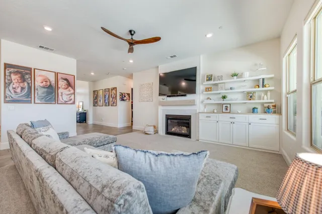 a living room with furniture fireplace and flat screen tv