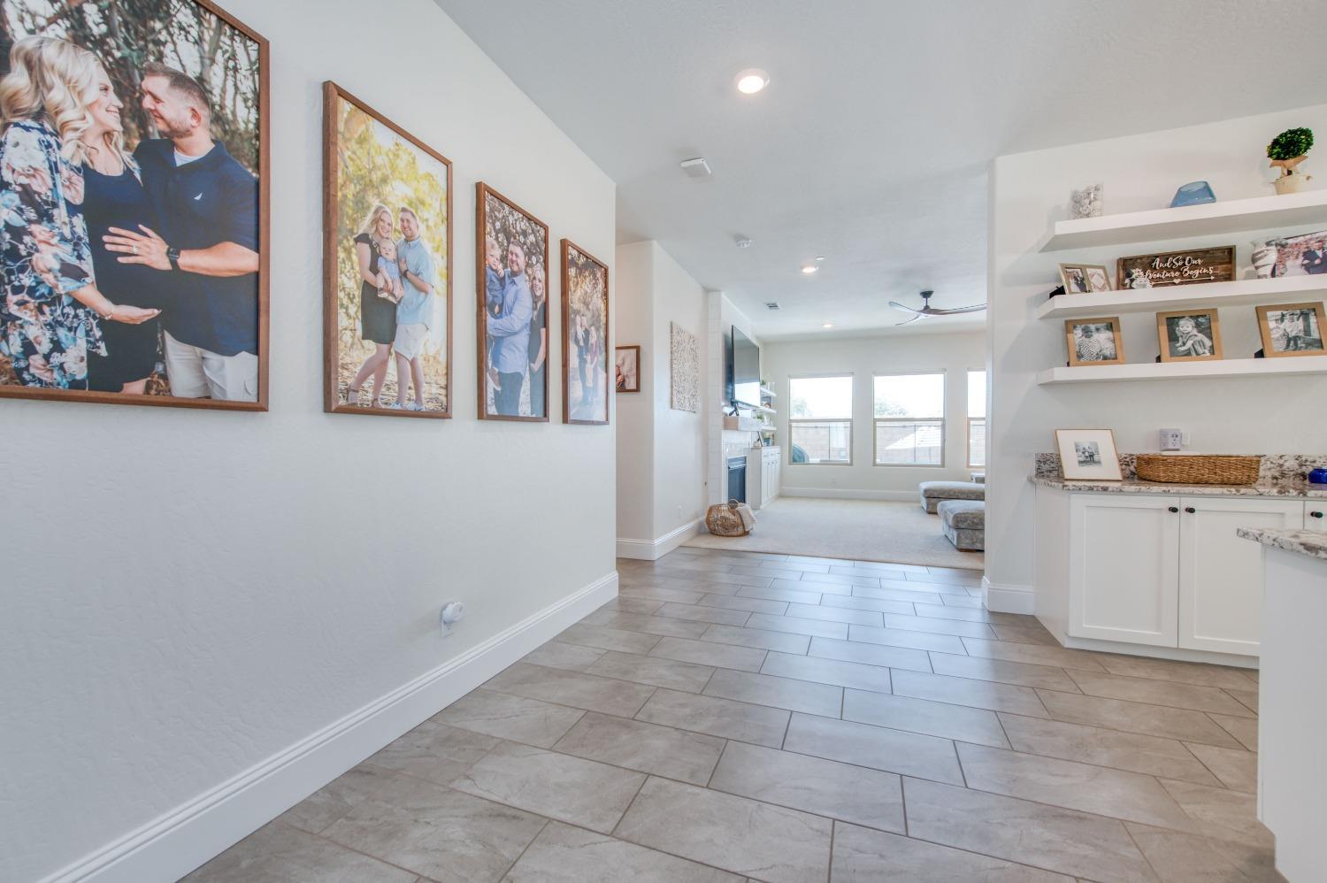 678 Ponderosa Way Madera, CA 93636 - Photo 9 of 38 a large white kitchen with dishwasher and furniture