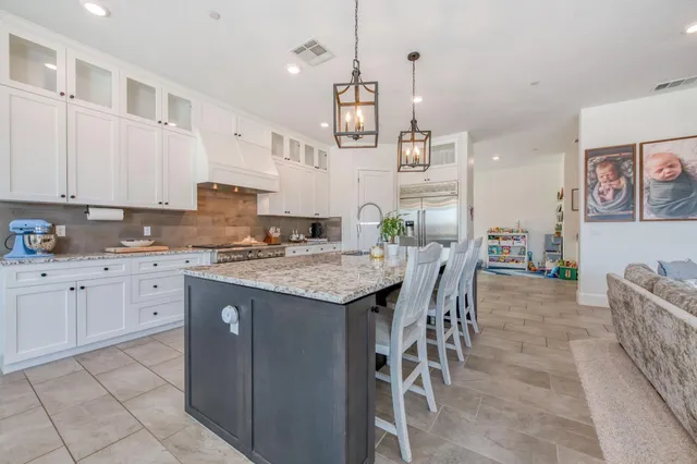 a stove top oven sitting inside of a kitchen