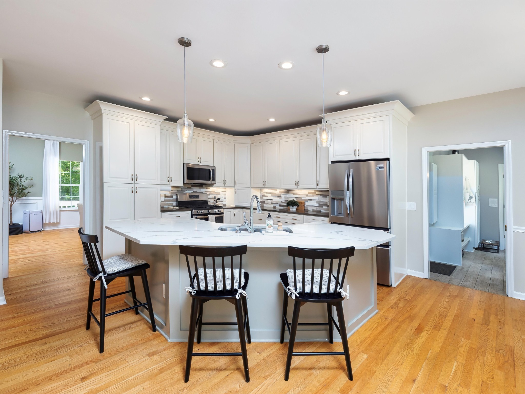 6480 Peytonsville-Arno Road College Grove, TN 37046 - Photo 25 of 96 a kitchen with stainless steel appliances a dining table chairs refrigerator sink and cabinets