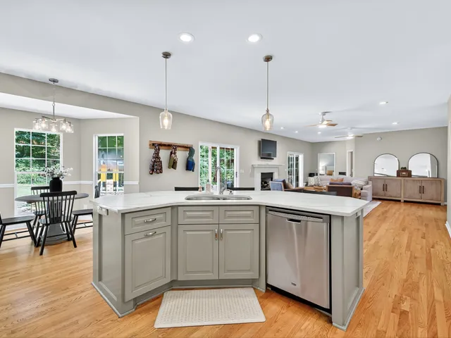 a bedroom with a bed and large window