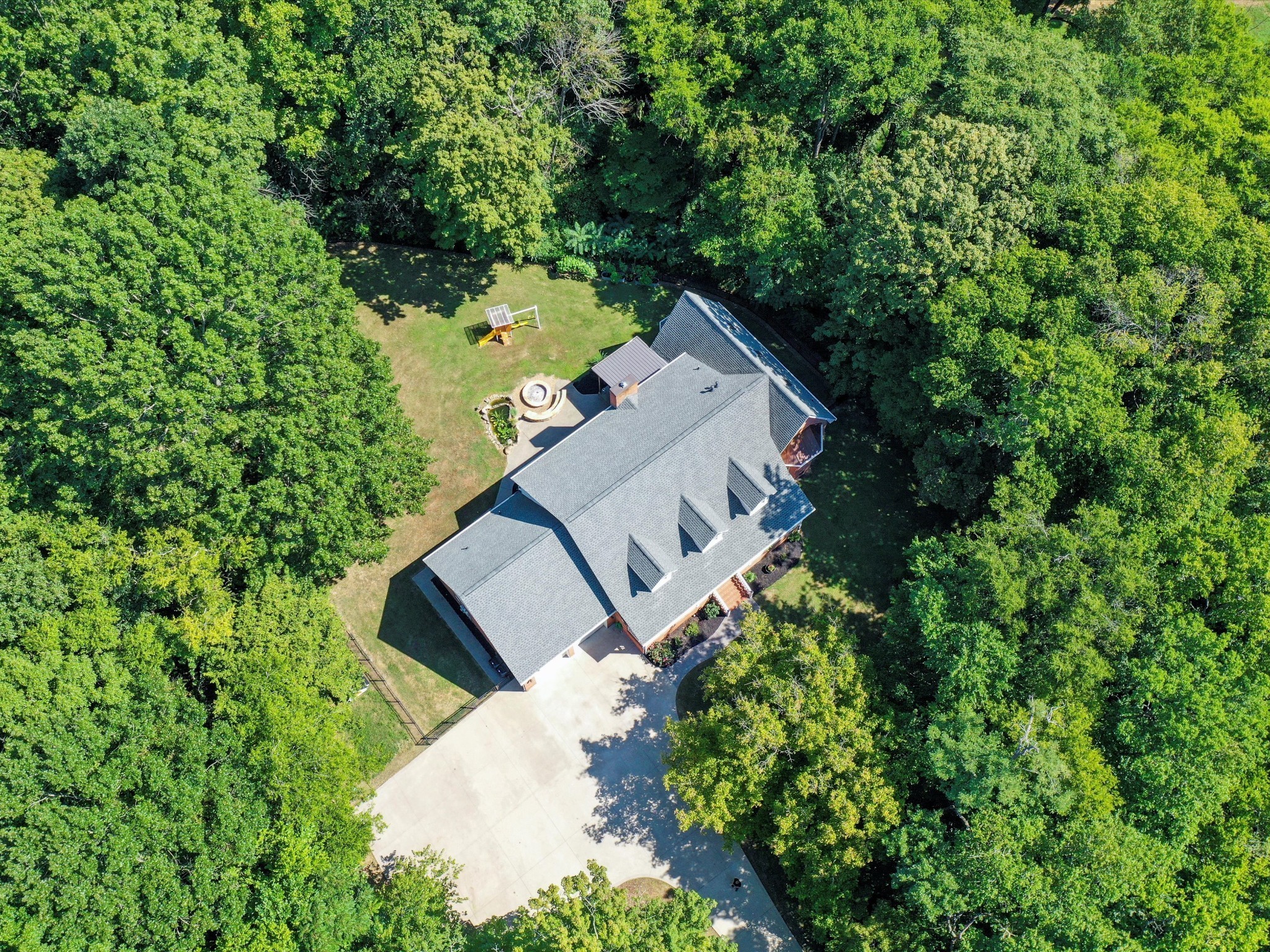 6480 Peytonsville-Arno Road College Grove, TN 37046 - Photo 68 of 96 an aerial view of a house with a yard and large trees