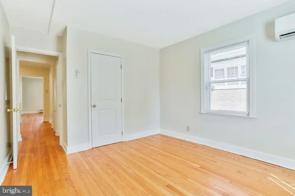 a view of a room that has a bed in it
