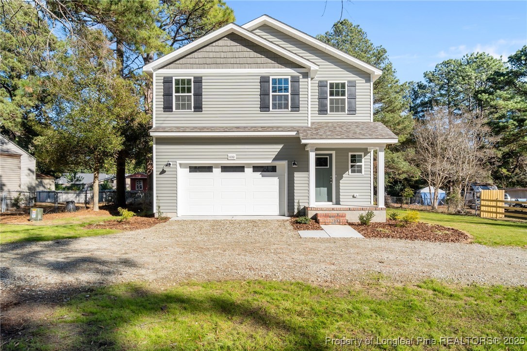 1010 Saunders Avenue Aberdeen, NC 28315 - Photo 1 of 44 a view of a house with a yard and large tree