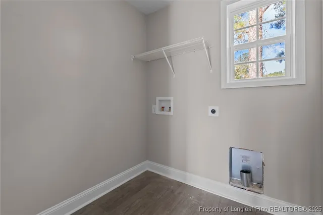 a view of an empty room with a window and a window