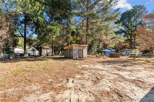 a backyard of a house with lots of green space
