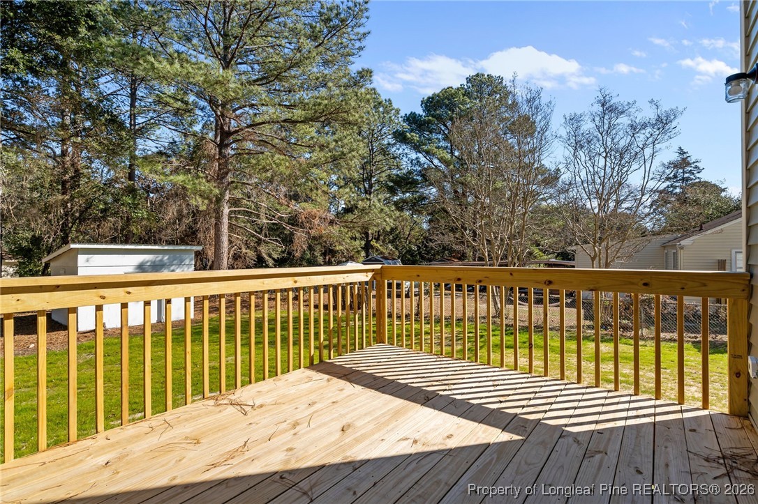 1010 Saunders Avenue Aberdeen, NC 28315 - Photo 36 of 44 a view of balcony with wooden floor and fence