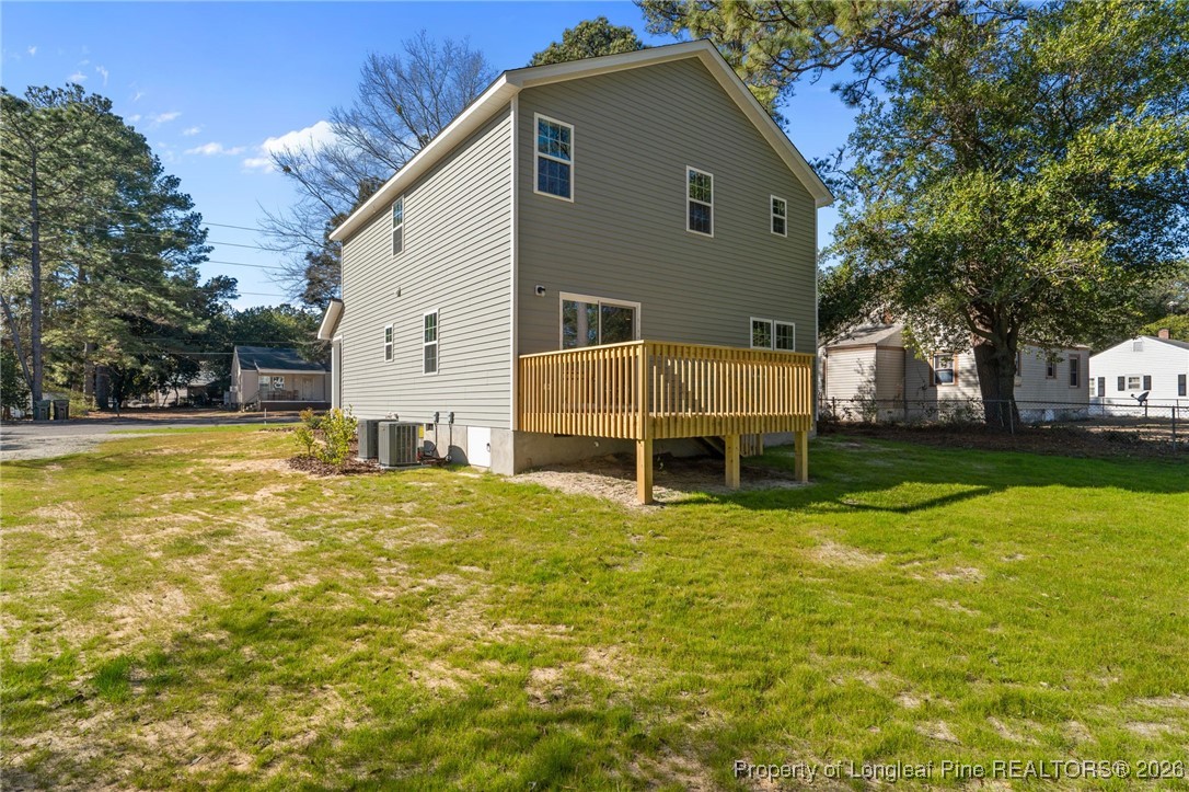 1010 Saunders Avenue Aberdeen, NC 28315 - Photo 42 of 44 a view of a house with a yard