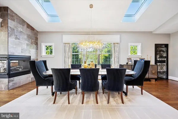 a bathroom with a granite countertop toilet sink and a mirror