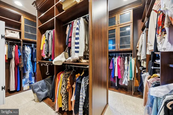 a kitchen with stainless steel appliances granite countertop a sink and wooden cabinets