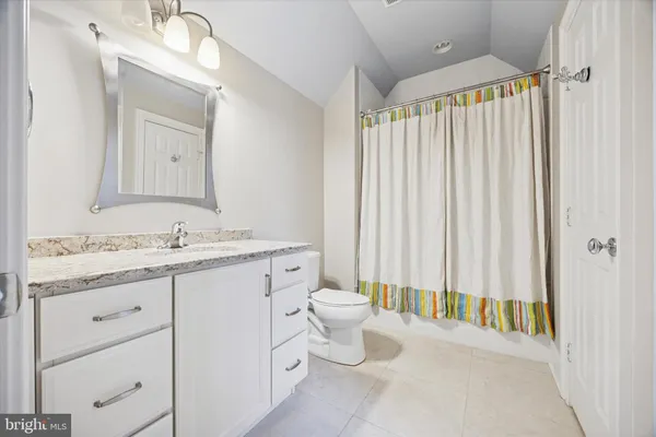 an aerial view of houses with yard