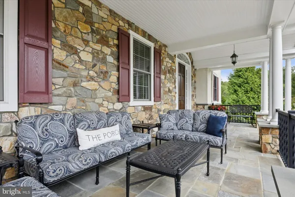 a front view of a house with many windows