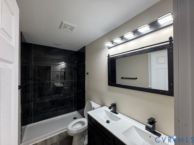 5000 Darbytown Road Henrico, VA 23231 - Photo 13 of 17 Dual sink vanity with matte black faucets, framed