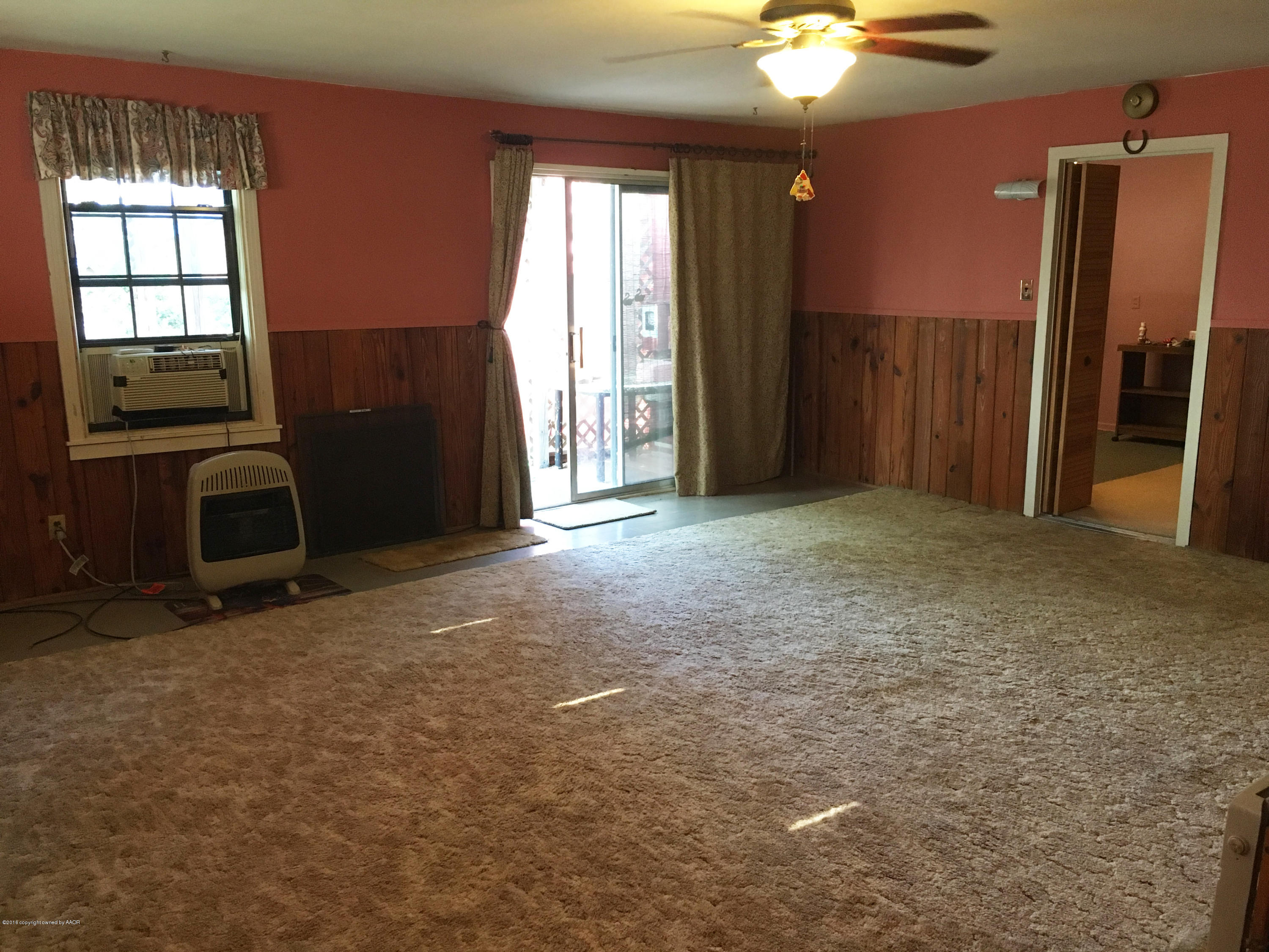 4619 South Lipscomb Street Amarillo, TX 79110 - Photo 5 of 15 an empty room with windows