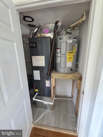 a bathroom with a toilet sink and window