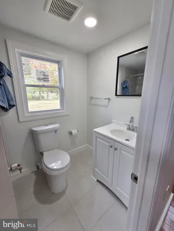 a bathroom with a toilet and a sink