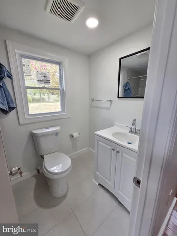 a bathroom with a toilet and a sink