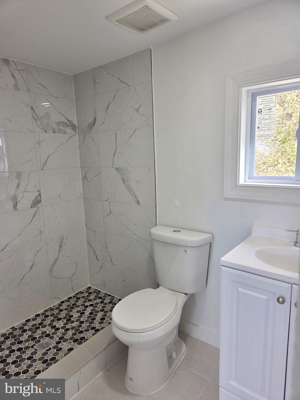 2527 Old House Point Road Fishing Creek, MD 21634 - Photo 28 of 34 a bathroom with a toilet and a sink