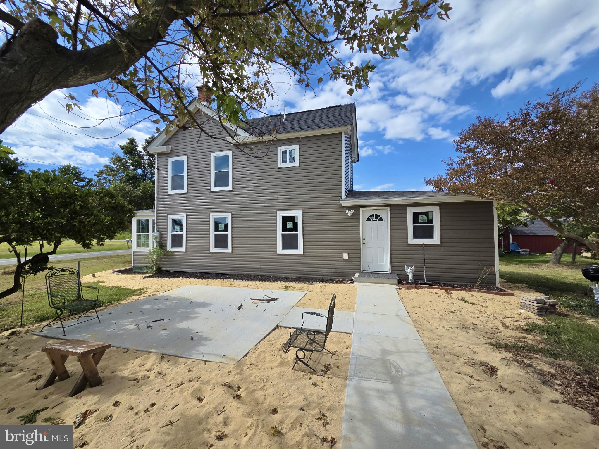 2527 Old House Point Road Fishing Creek, MD 21634 - Photo 4 of 34 a front view of a house with a yard