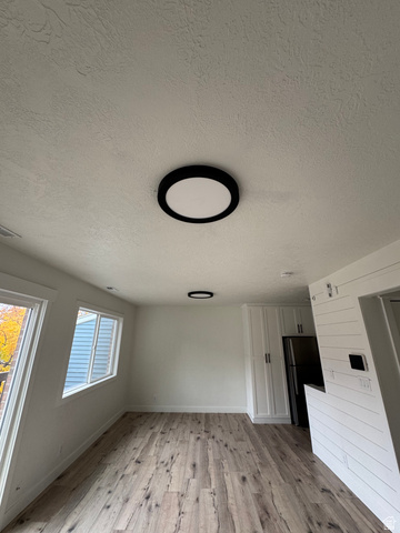608 South 500 West, Unit 3 Provo, UT 84601 - Photo 18 of 35 Interior space featuring wood-finish flooring, white walls, and two large windows