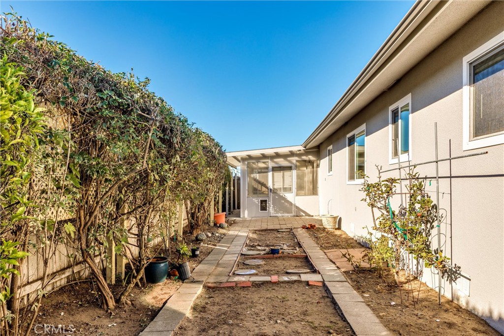 160 Verdon Street Morro Bay, CA 93442 - Photo 23 of 34 a view of a pathway with a house in the background