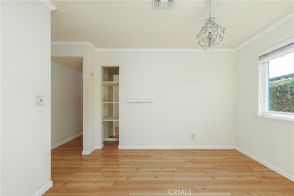 160 Verdon Street Morro Bay, CA 93442 - Photo 8 of 34 a view of an empty room with wooden floor and a window