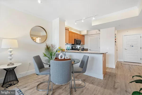 a living room with kitchen island furniture and a wooden floor