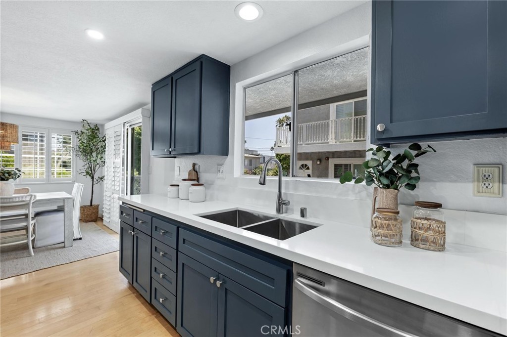 1421 12th Street, Unit 1 Manhattan Beach, CA 90266 - Photo 13 of 36 a kitchen with sink a counter space and cabinets