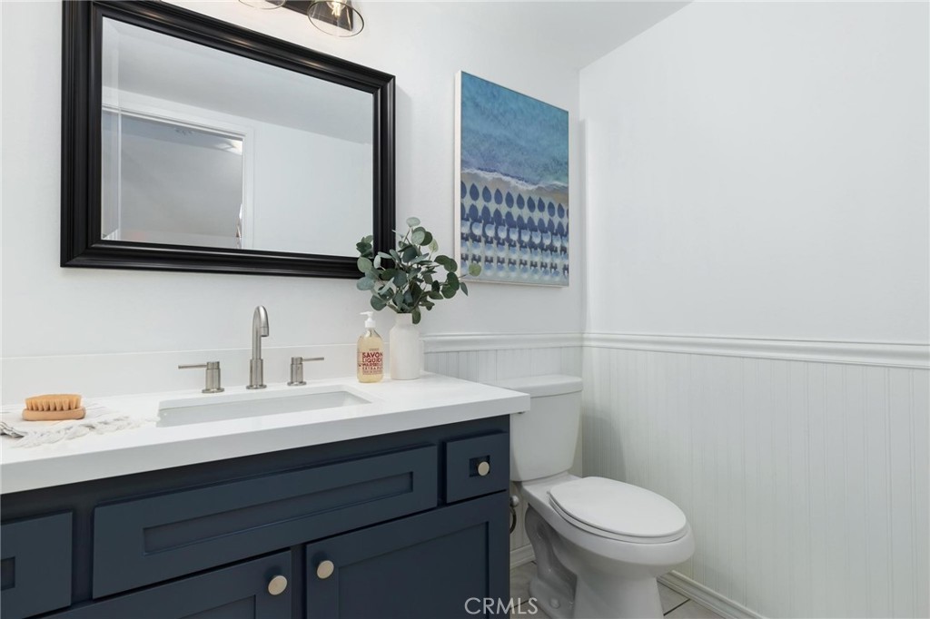 1421 12th Street, Unit 1 Manhattan Beach, CA 90266 - Photo 17 of 36 a bathroom with a toilet sink and mirror