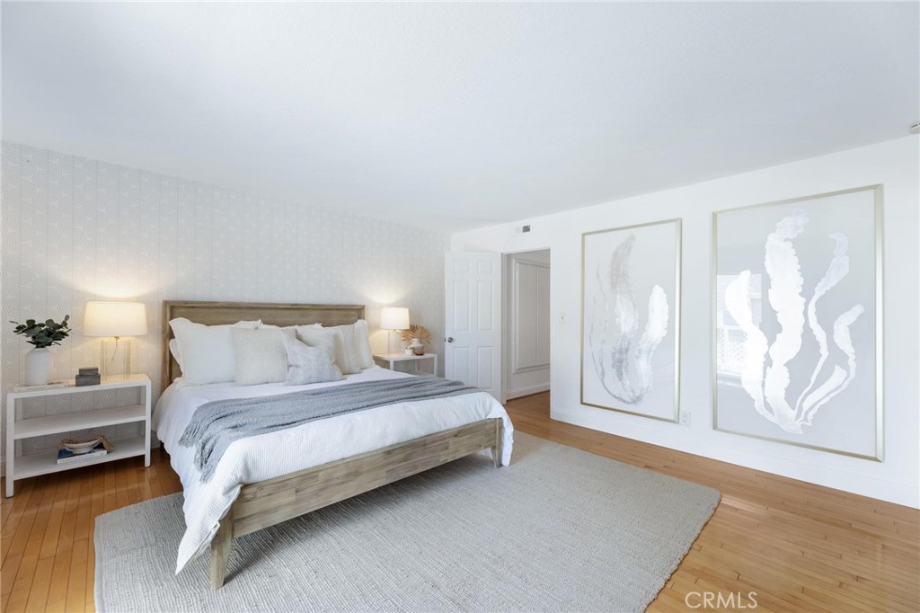 1421 12th Street, Unit 1 Manhattan Beach, CA 90266 - Photo 19 of 36 a bed room with a bed and a night lamp