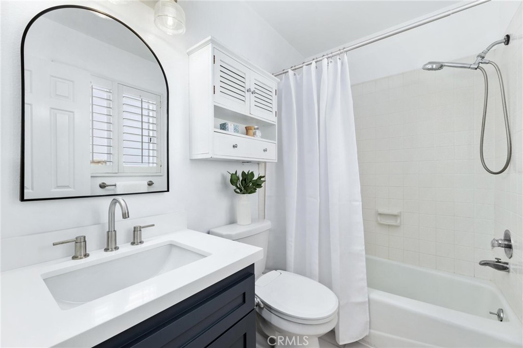 1421 12th Street, Unit 1 Manhattan Beach, CA 90266 - Photo 22 of 36 a bathroom with a sink toilet and shower