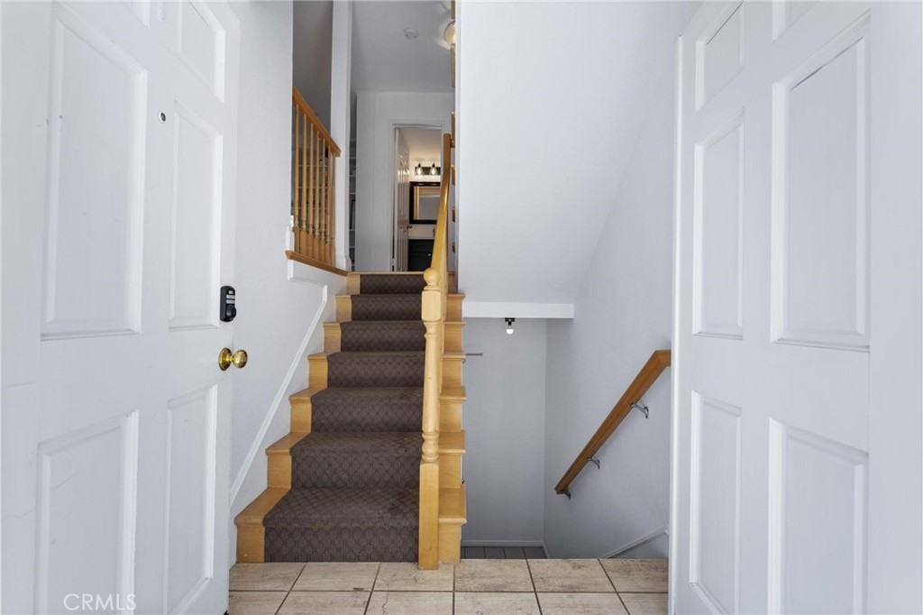 1421 12th Street, Unit 1 Manhattan Beach, CA 90266 - Photo 30 of 36 a view of staircase with lots of frames on wall and stairs