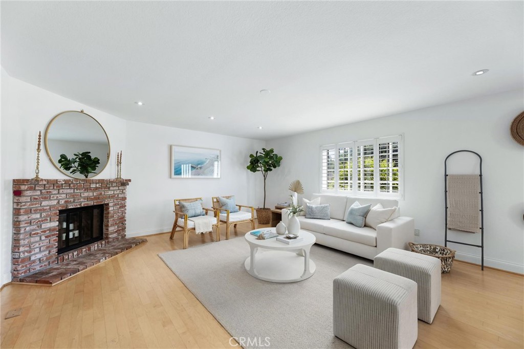 1421 12th Street, Unit 1 Manhattan Beach, CA 90266 - Photo 3 of 36 a living room with furniture and a fireplace