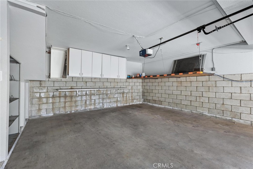 1421 12th Street, Unit 1 Manhattan Beach, CA 90266 - Photo 33 of 36 a view of an empty room with wooden walls