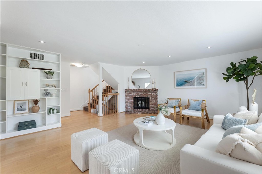 1421 12th Street, Unit 1 Manhattan Beach, CA 90266 - Photo 4 of 36 a living room with furniture and a fireplace