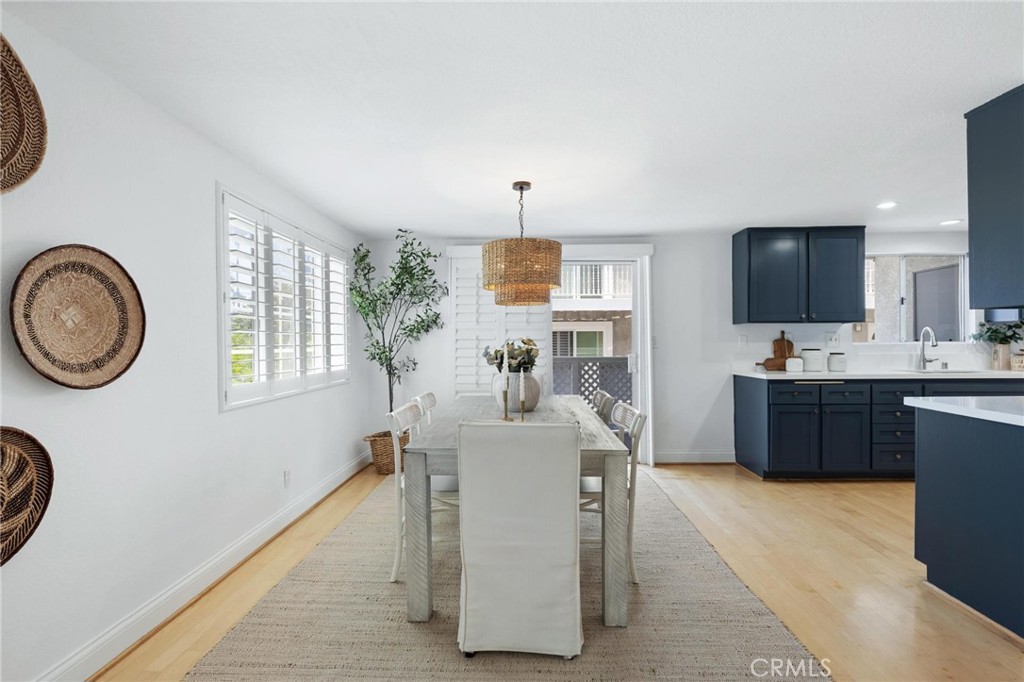 1421 12th Street, Unit 1 Manhattan Beach, CA 90266 - Photo 8 of 36 a living room with furniture a flat screen tv and a window
