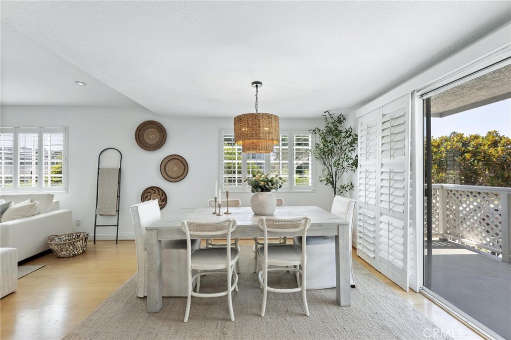 1421 12th Street, Unit 1 Manhattan Beach, CA 90266 - Photo 10 of 36 a dining room with furniture and a window
