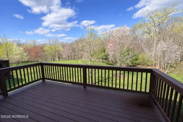 a balcony with wooden floor in view